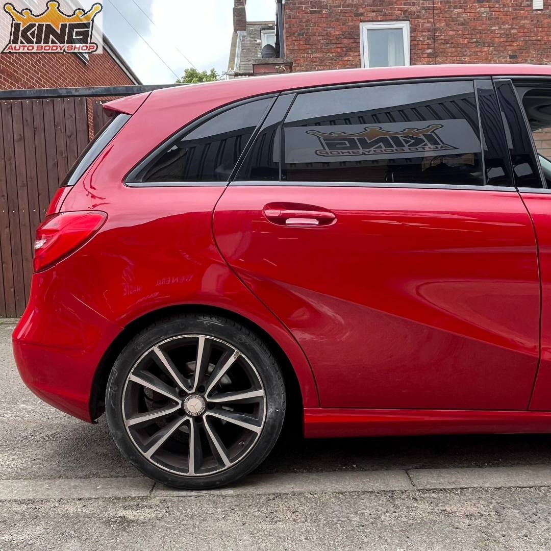 A car with the body damage repaired.