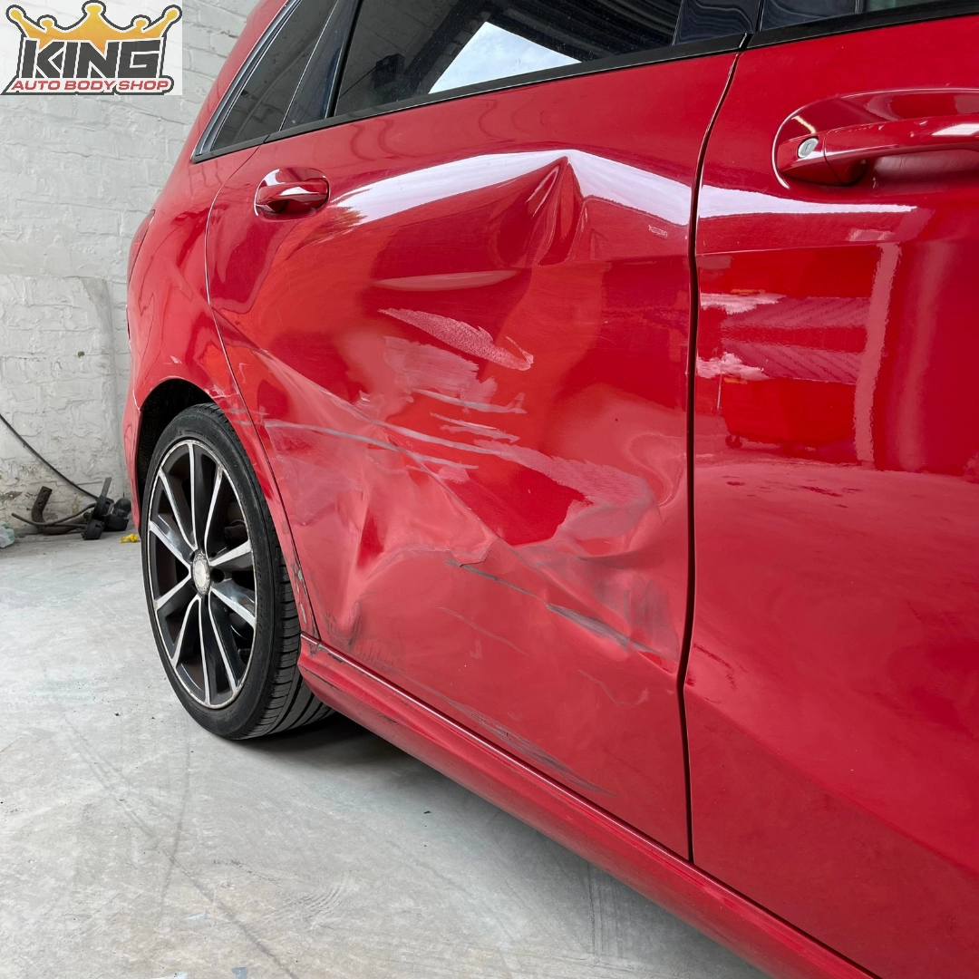 A car showing body damage.