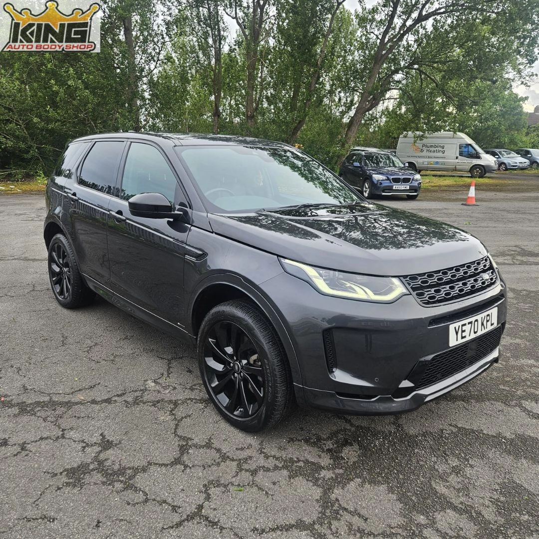 A car with the body damage repaired.