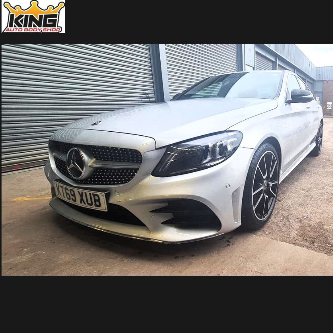 A car with the body damage repaired.