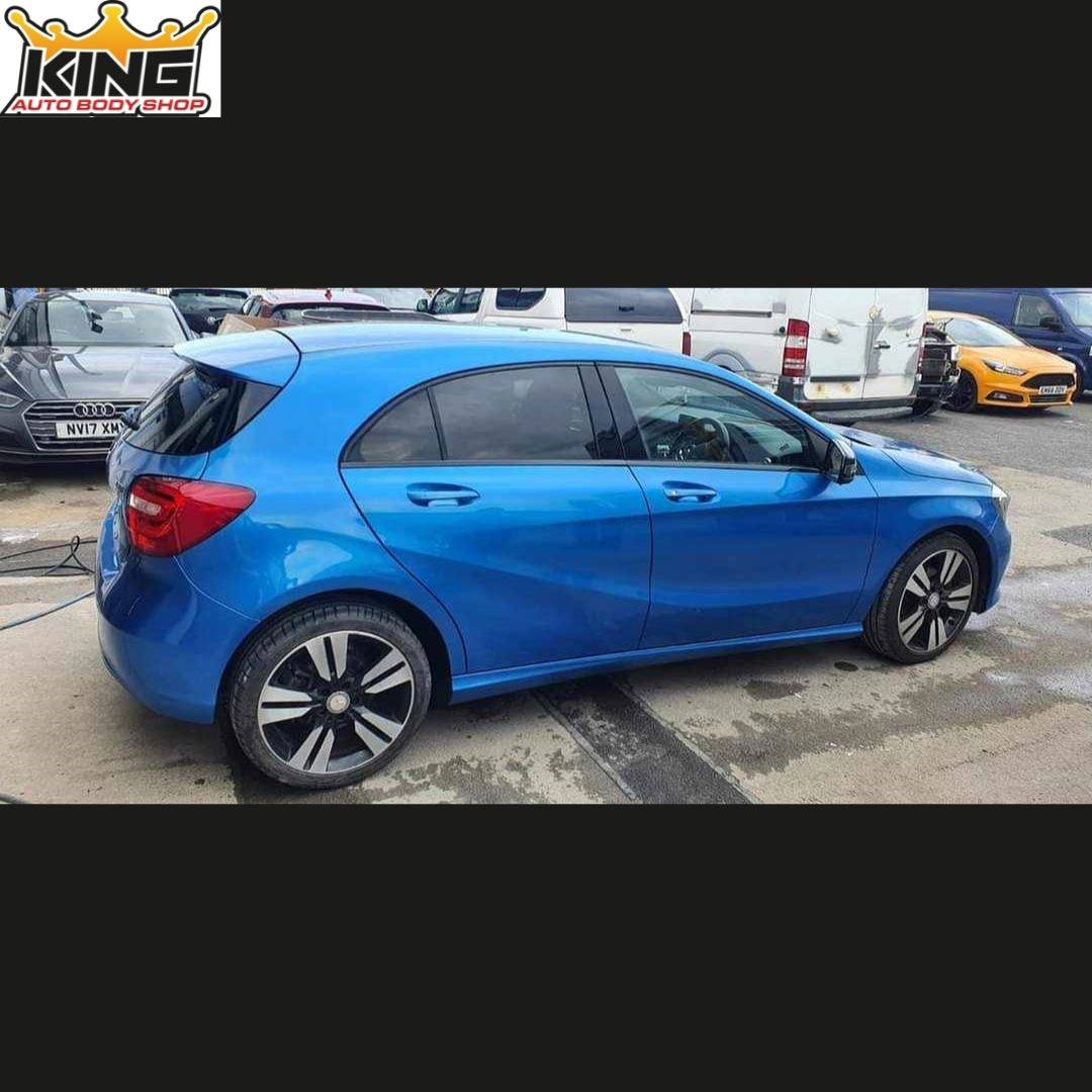 A car with the body damage repaired.