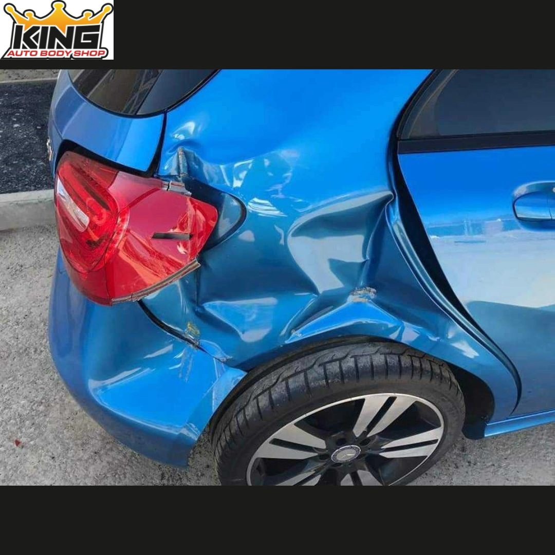 A car showing body damage.